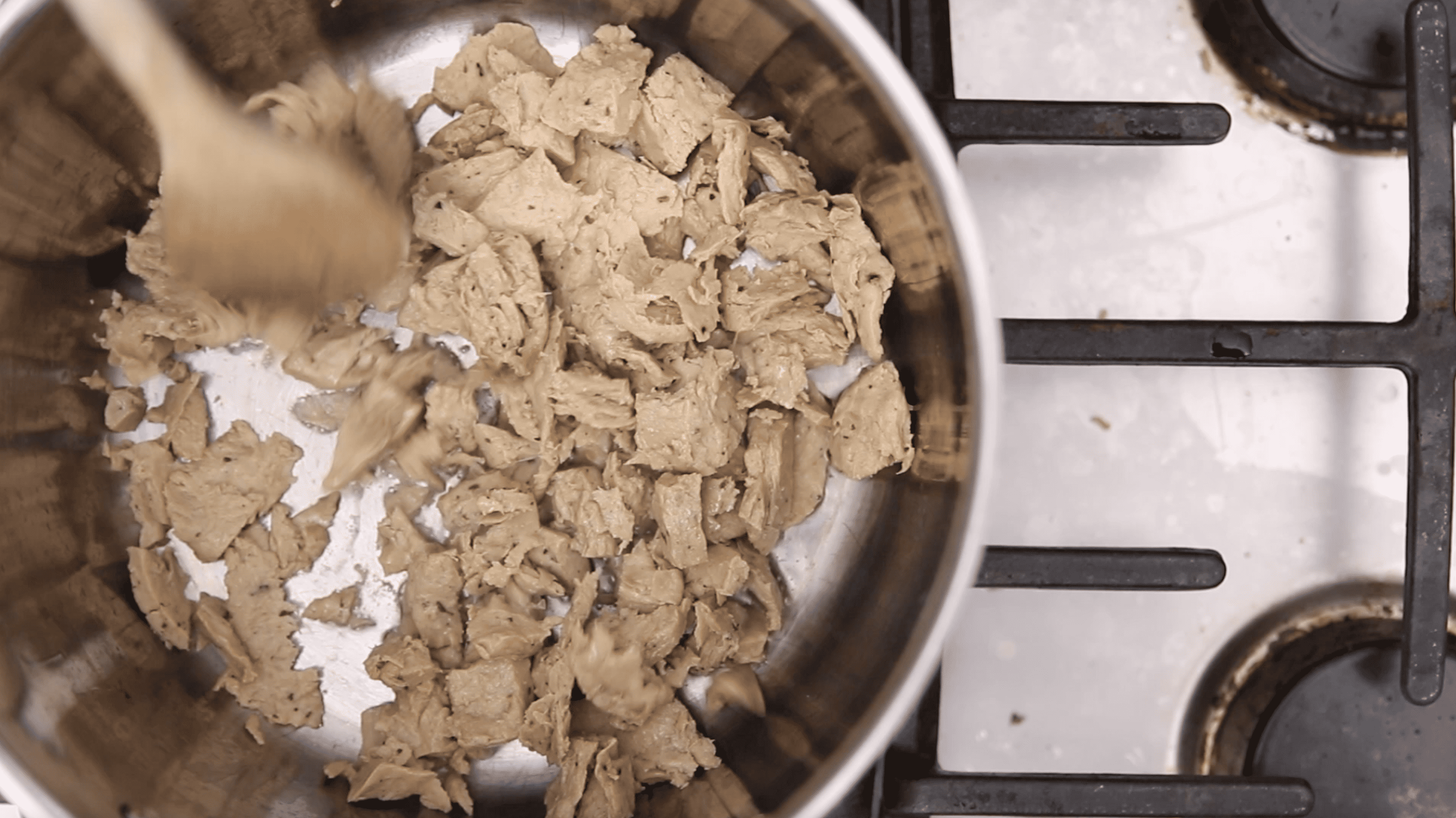 overhead of pot with vegan chicken being browned