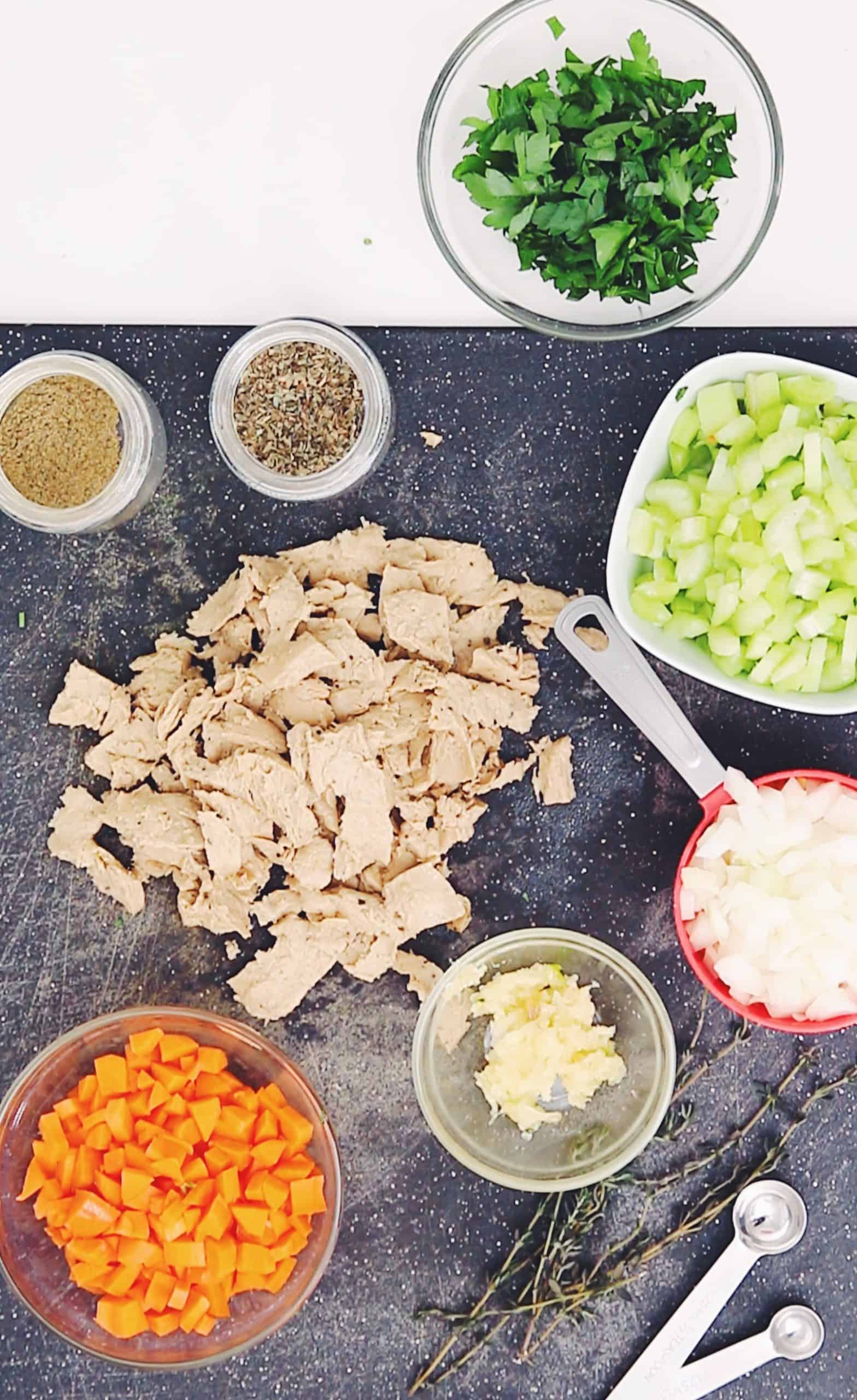 overhead of all ingredients for vegan chicken noodle soup