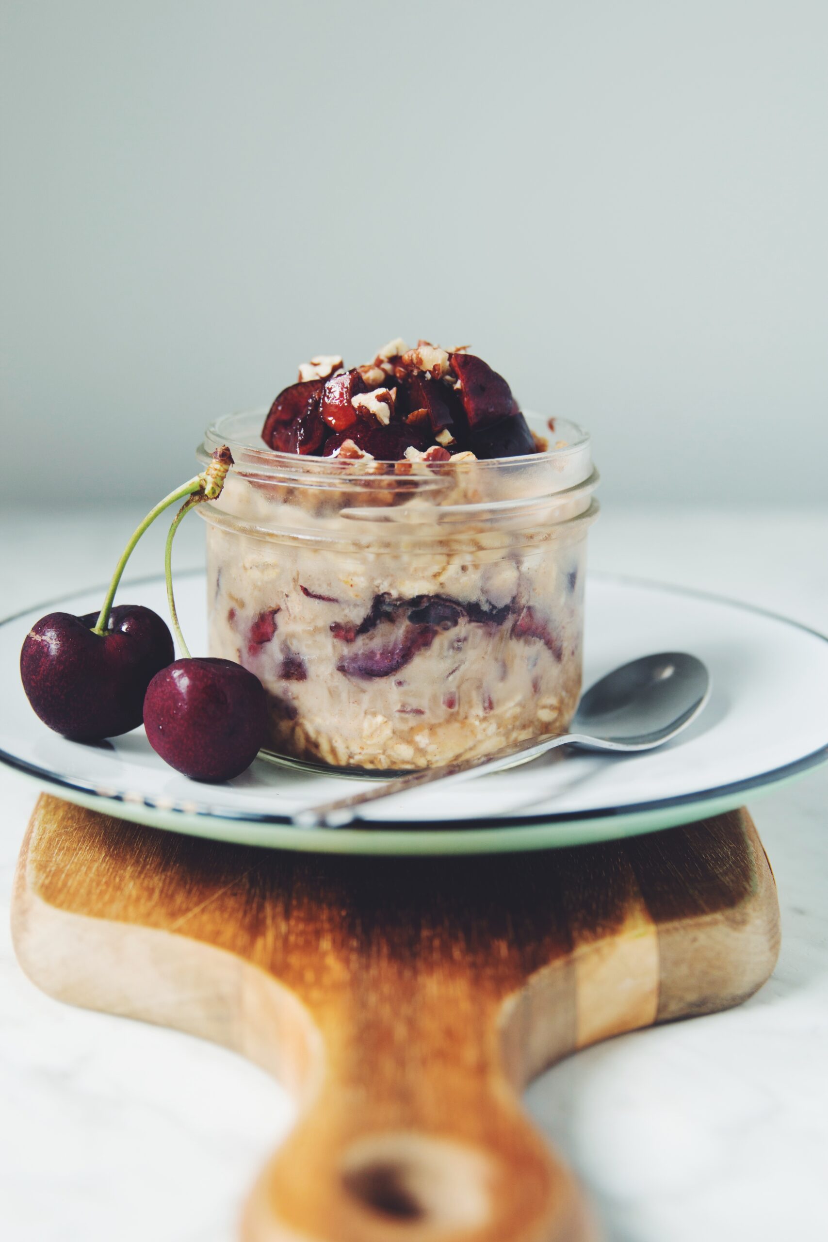 straight on shot of vegan cherry pie overnight oats in a jar