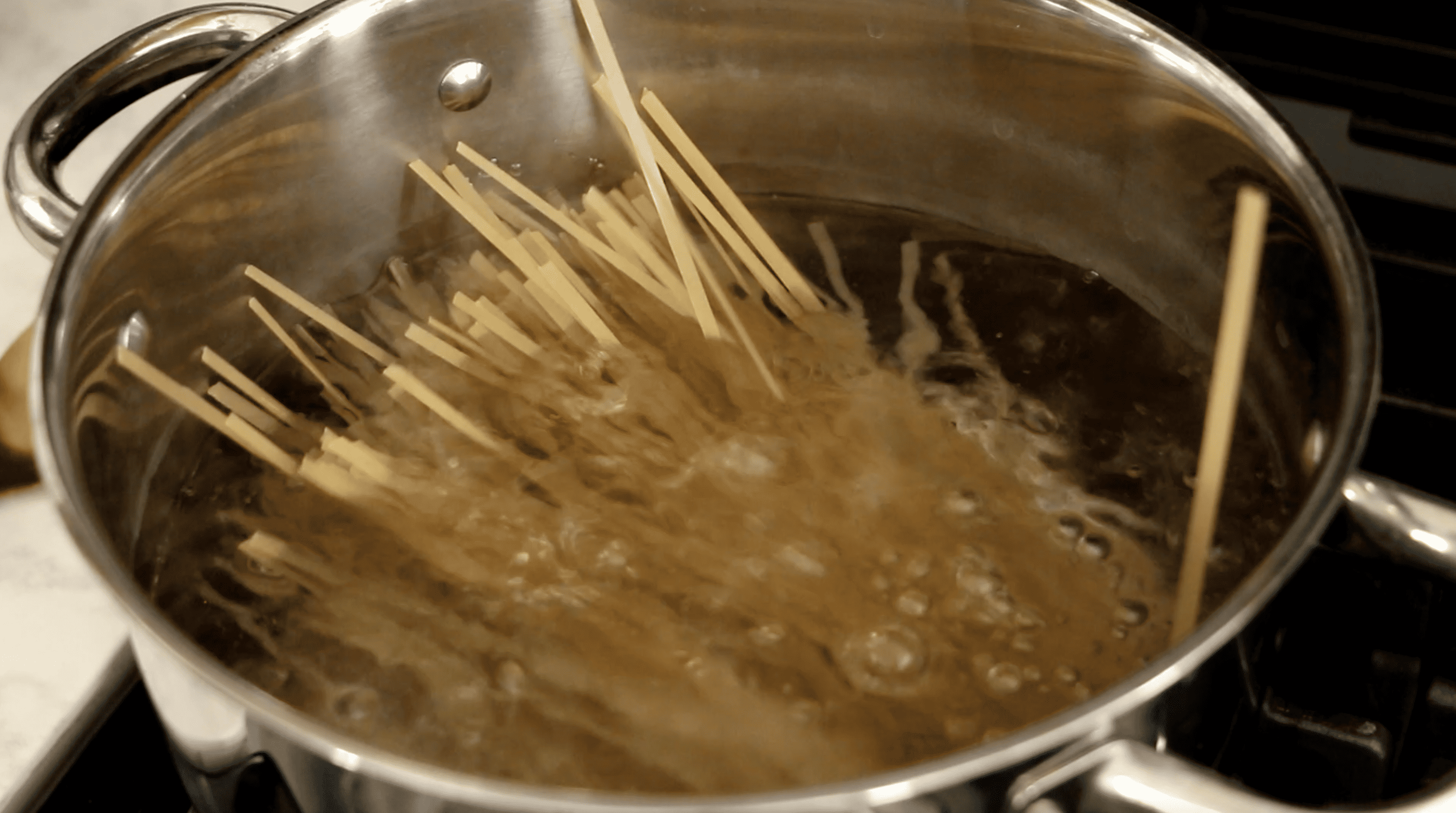 noodles cooking in boiling water