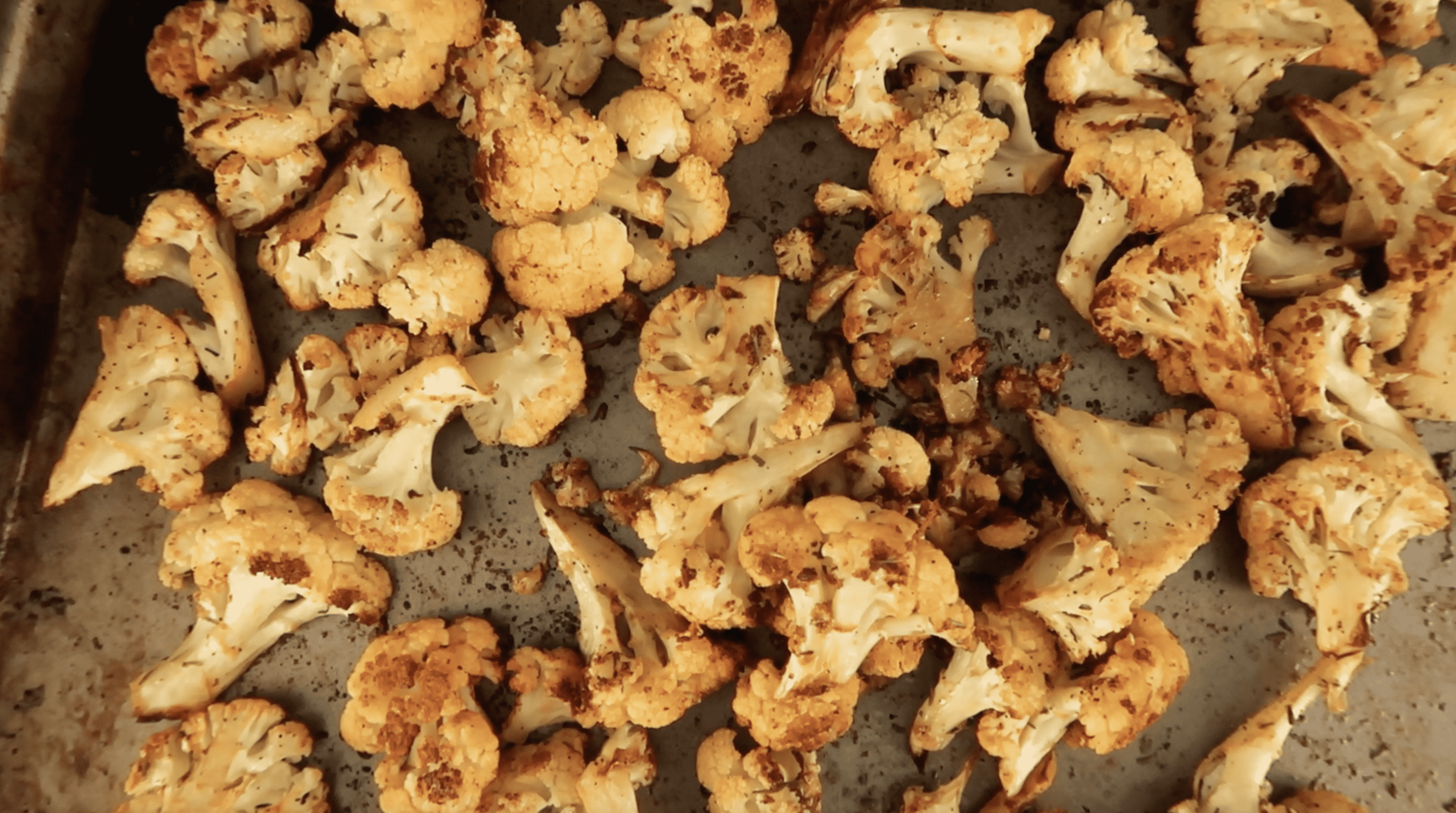 roasted cauliflower on a baking sheet