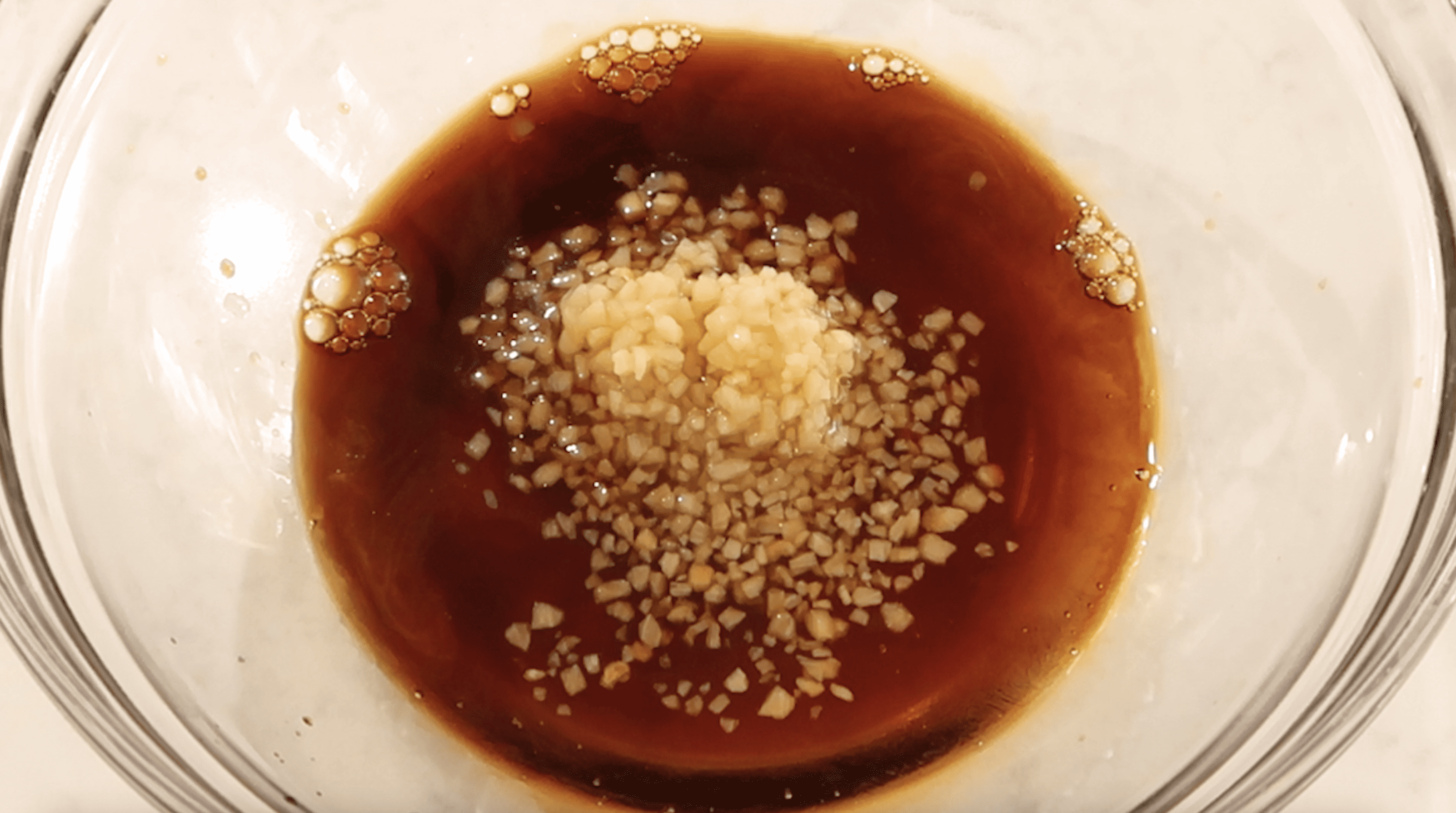 mixing bowl of sweet soy sauce and garlic