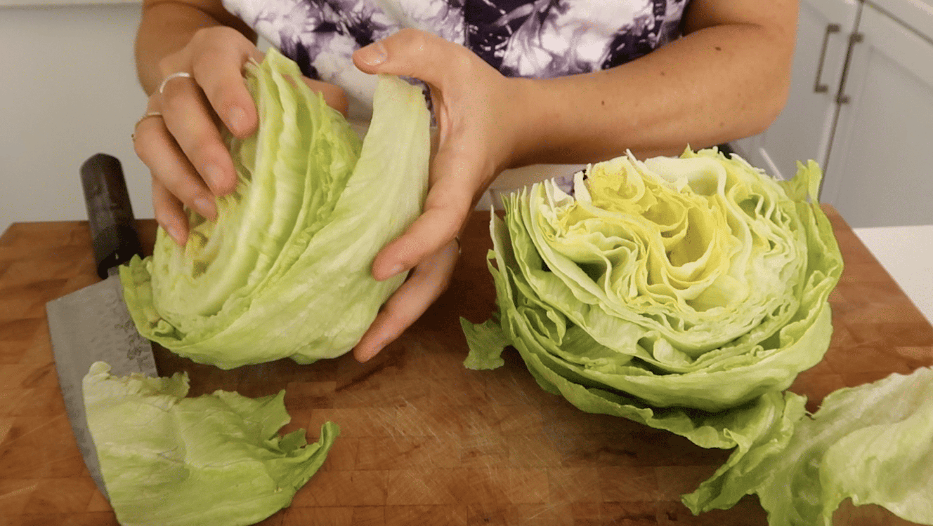 breaking iceberg lettuce into cups