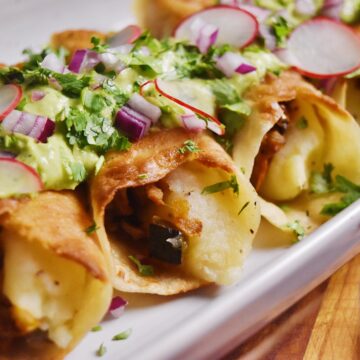 jackfruit and potato flautas with avocado sauce