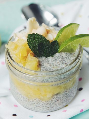 diners view of a jar of chia pudding flavored with pineapple