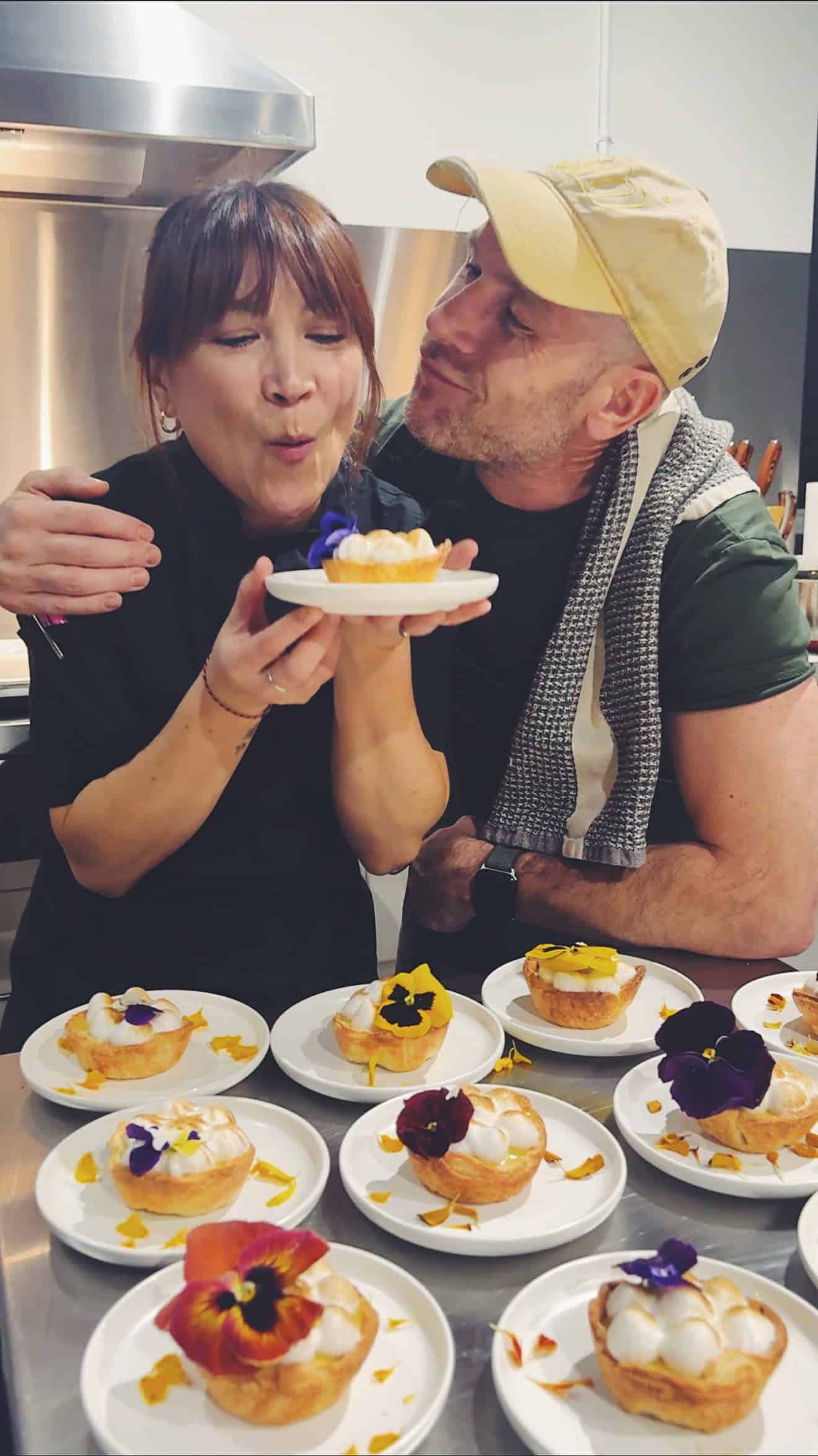 chef Lauren Toyota at her Toronto event holding a lemon meringue tart